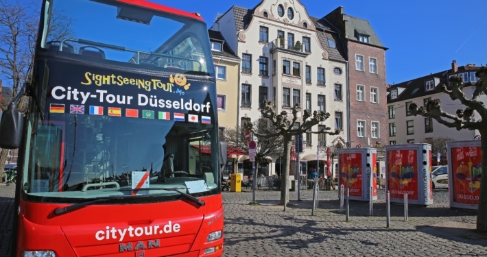 Düsseldorf,(burgplatz),,Germany,-,March,9.,2022:,View,On,Red Hop on hop off Bus in der Altstadt Düsseldorf